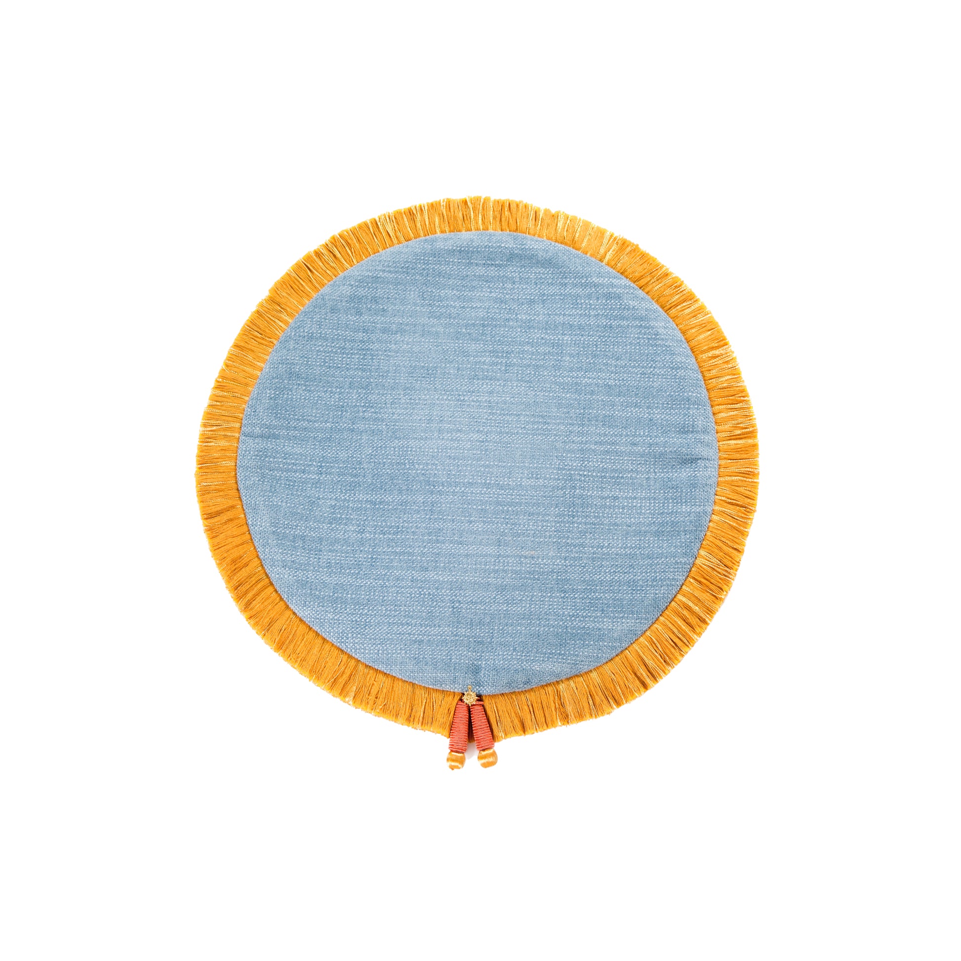 A round woven textile piece in light blue with a wide mustard-yellow fringe border and small hanging tassels, shown on a plain white background.